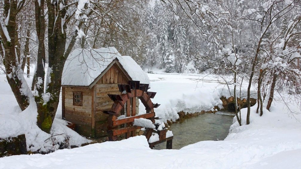 A winter scene at a little water mill at Lake Jasna in Kranjska Gora 