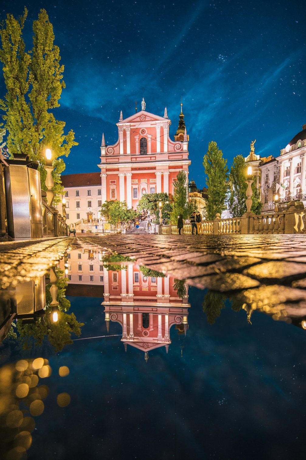 The pink Franciscan Church of the Annunciation in Ljubljana at night