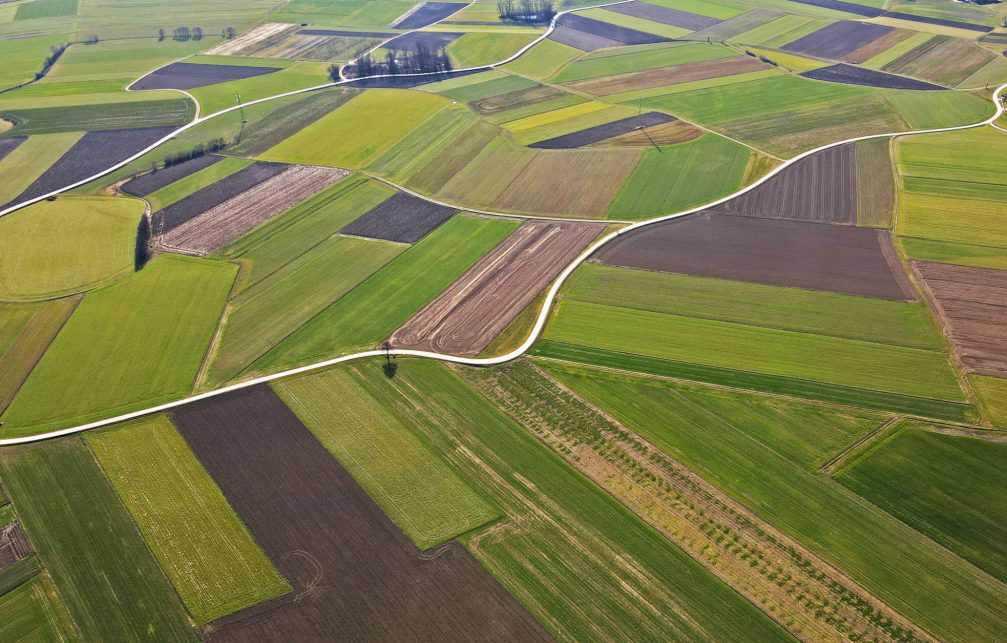 Aerial view of colourful fields in the Prekmurje region of Slovenia