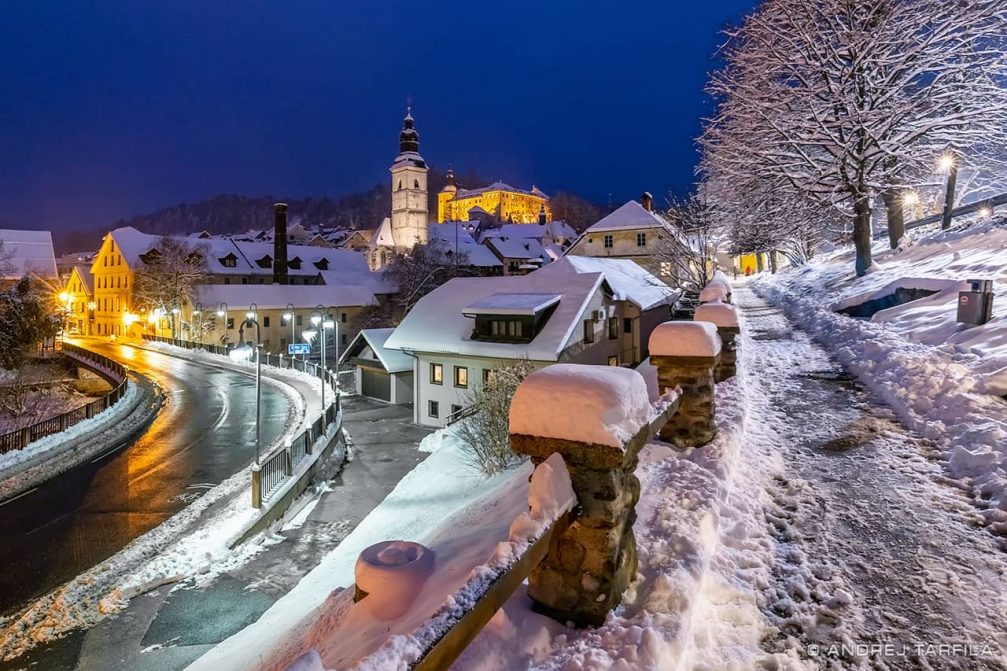 Skofja Loka in Slovenia covered in snow at night 