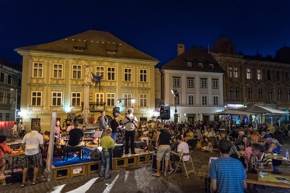 A summer event with lots of visitors in Ljubljana Old Town at night