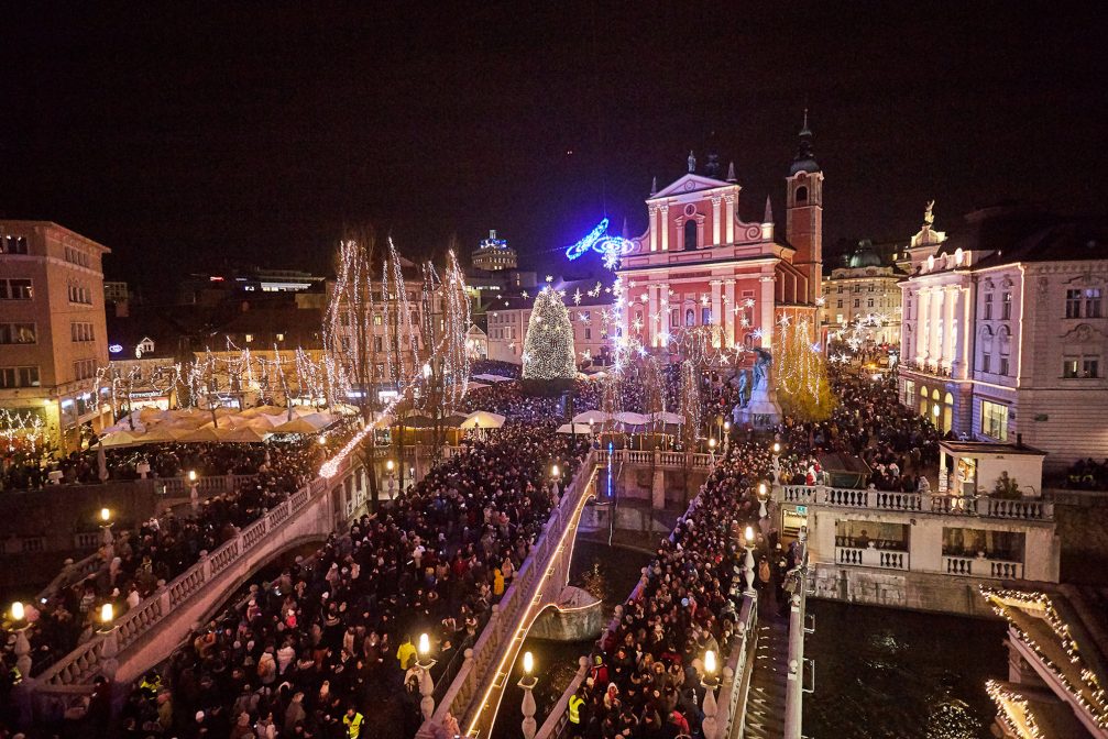 Triple Bridge in the festive season with Ljubljana Old Town decorated with Christmas lights