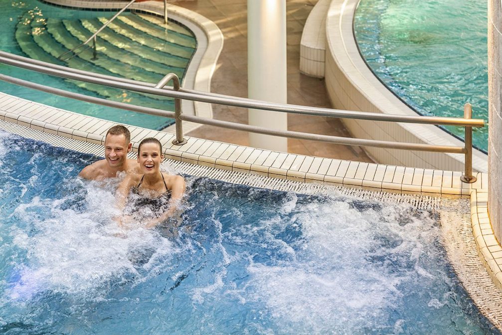 A couple in indoor pools at Terme 3000 Thermal Bath Complex in Moravske Toplice