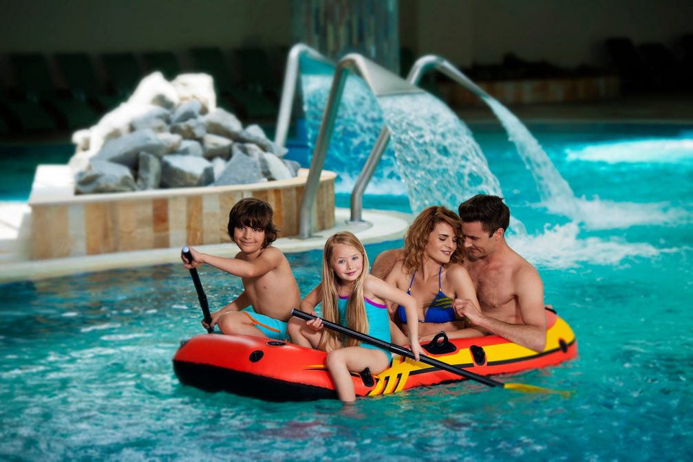 A family in indoor pools at Terme 3000 Thermal Bath Complex in Moravske Toplice