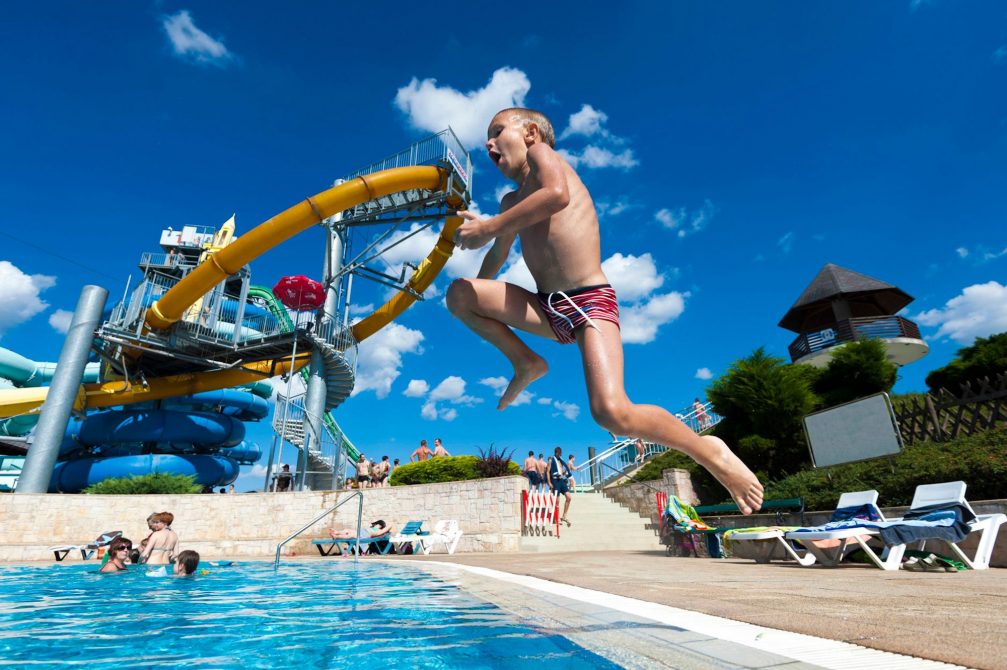 A child diving at Terme 3000 Thermal Bath Complex in Moravske Toplice