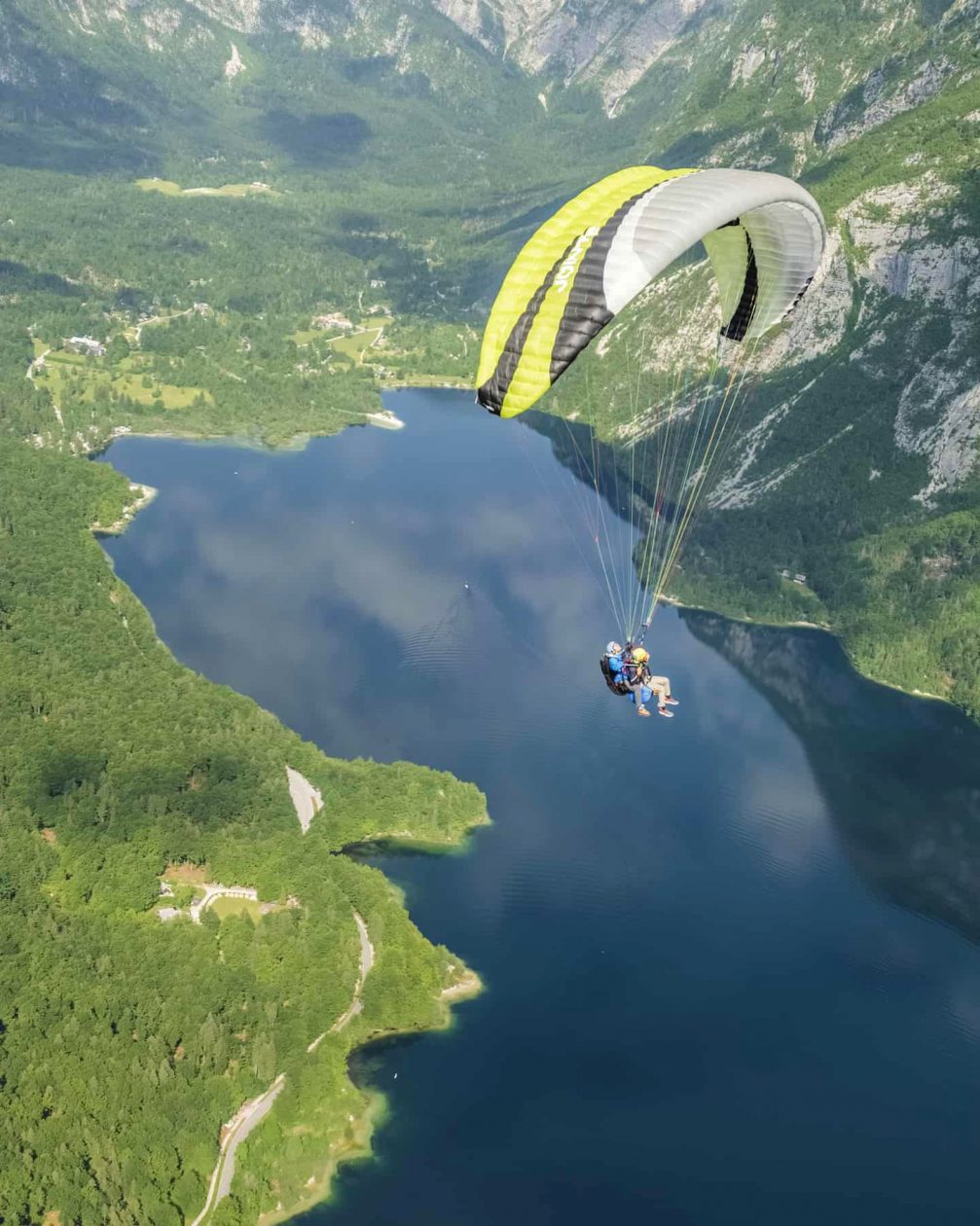 Tandem paragliding above Lake Bohinj in Slovenia