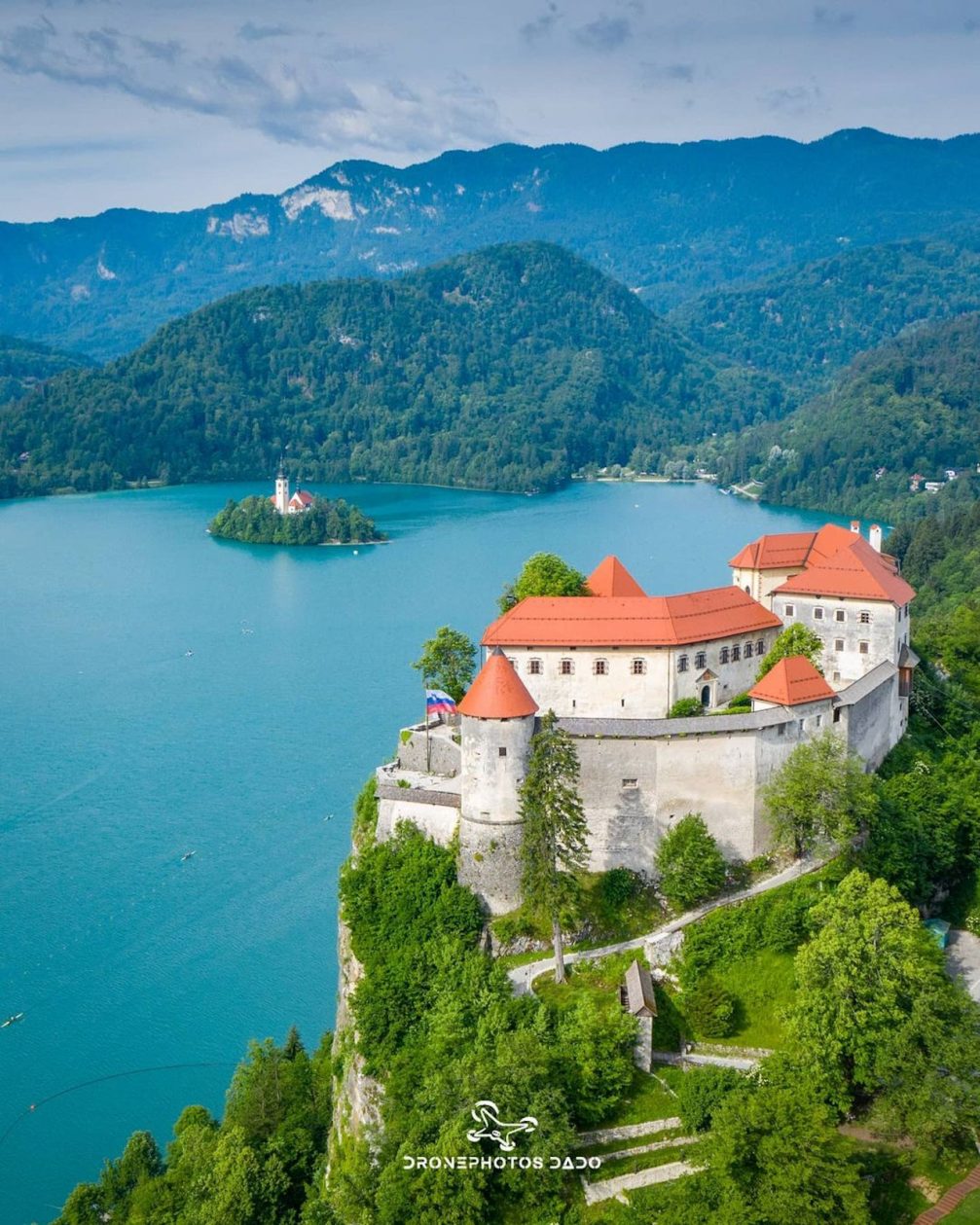 Aerial drone view of Bled Castle with Lake Bled in the background