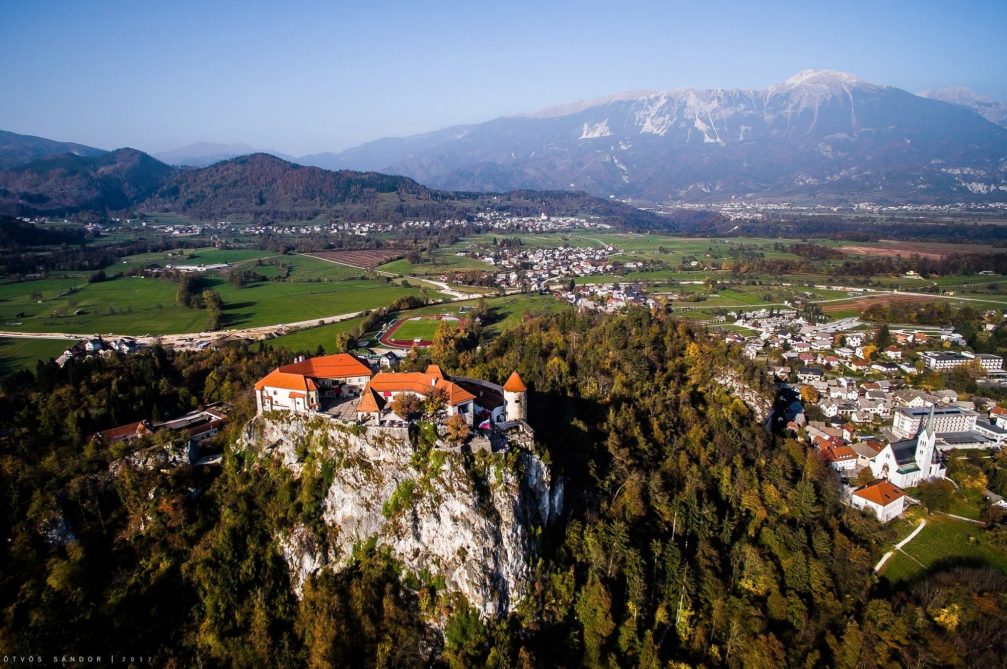 Aerial drone view of Bled Castle in Slovenia in the fall season