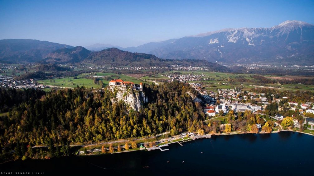 Aerial drone photography of Lake Bled and Bled Castle in Slovenia in the fall season