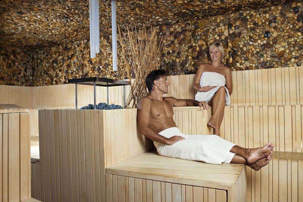 A couple in the dry SAVU Finnish sauna at Terme Olimia Thermal Spa in Podcetrtek