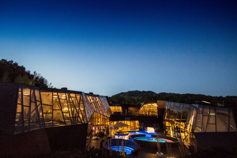 Exterior of Wellness Orhidelia thermal spa in Terme Olimia at night