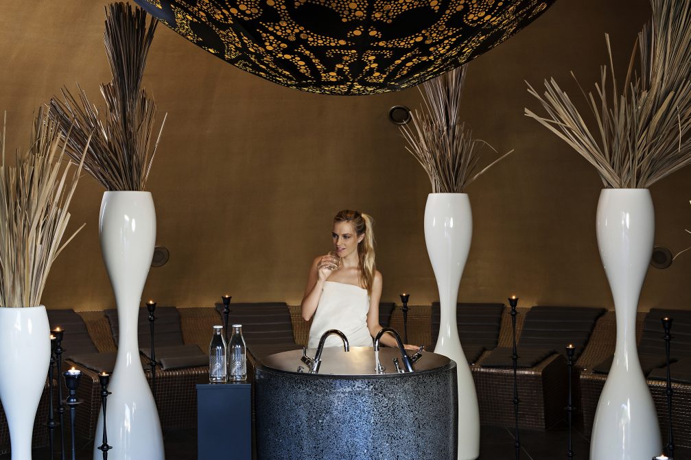 A woman drinking thermal water at Wellness Orhidelia thermal spa in Terme Olimia