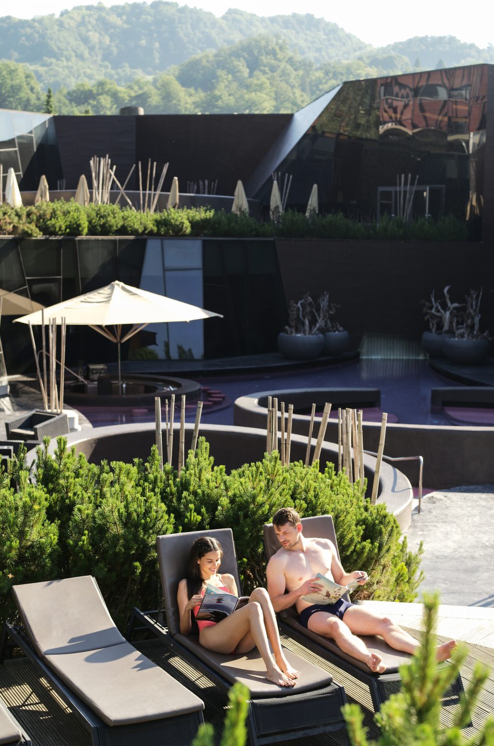 A couple on sunbathers at Wellness Orhidelia thermal spa in Terme Olimia