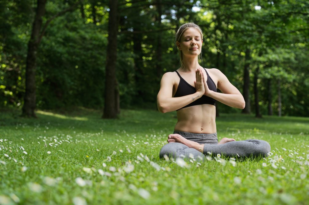 A woman doing yoga at Terme Olimia in Podcetrtek