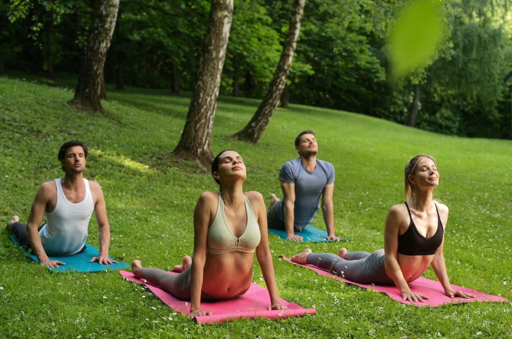 A group of people practising yoga at Terme Olimia in Podcetrtek