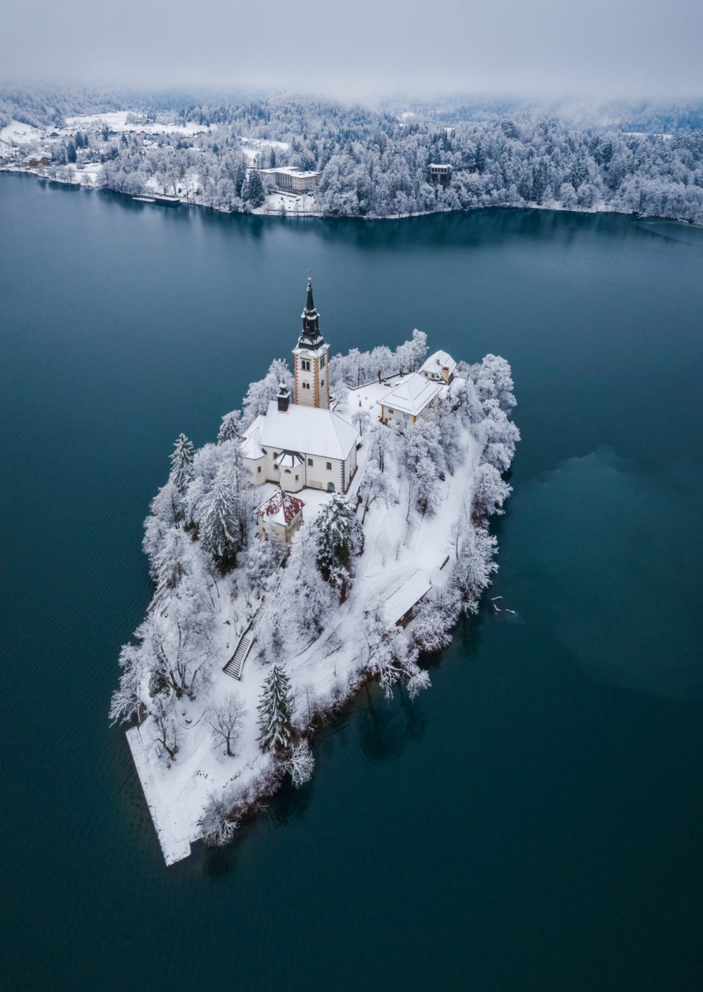 Aerial photo of Bled Island covered with a white blanket of fresh new snow